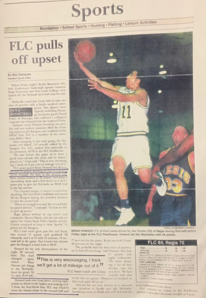 Coach working with young basketball players